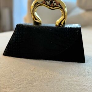 Elegant Black Handbag with Gold Handle